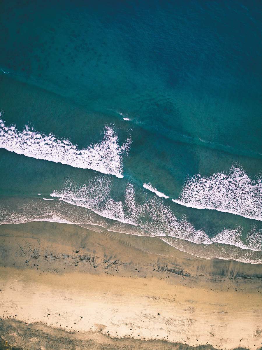 ocean aerial photography of seawaves at daytime water